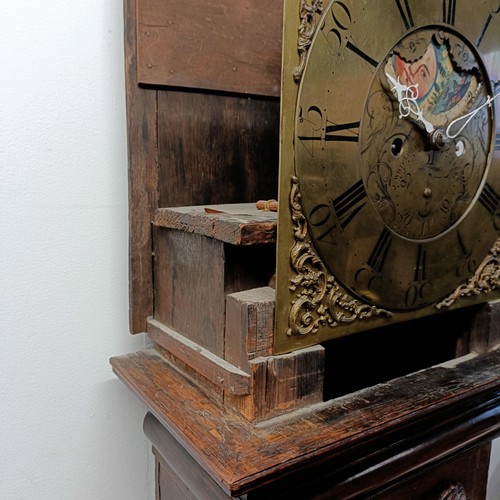 979 - A longcase clock, the brass dial signed J Whitworth, Lussley, with a phase of the moon and a subsidi... 