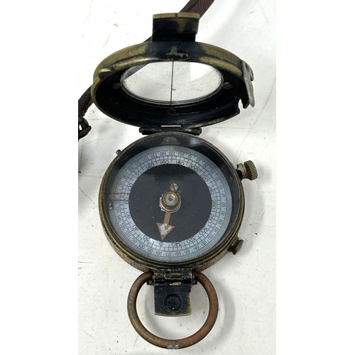 539 - A WWI compass, 1918, in a leather Pulley & Powell 1916 leather case, and a pair of heavily tinte... 