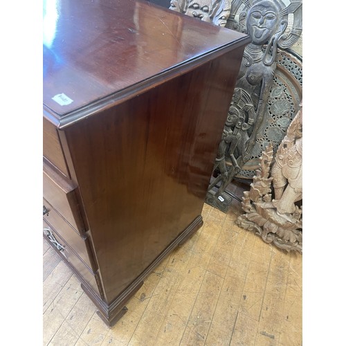 1046 - A 19th century mahogany chest, having two short and three long drawers, 105 cm wide