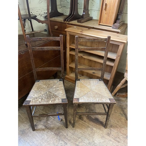 993 - A pine dresser base, 125 cm wide, an oak drop leaf table, a rocking chair, a wine rack, a doll's hig... 