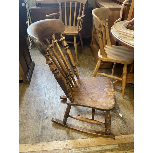 993 - A pine dresser base, 125 cm wide, an oak drop leaf table, a rocking chair, a wine rack, a doll's hig... 