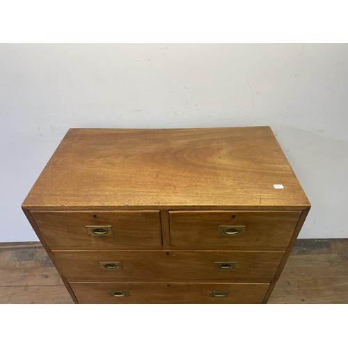 995 - A teak military style chest, having two short and three long drawers, 92 cm wide