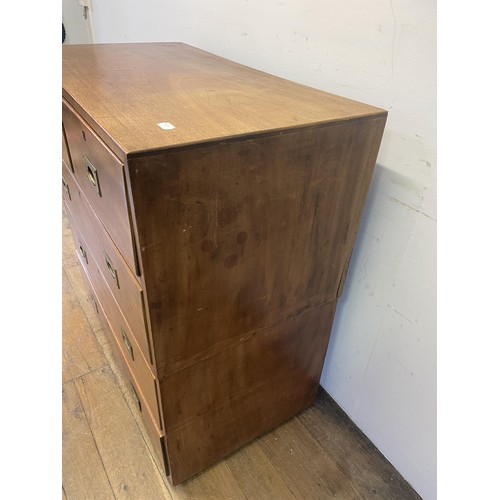 995 - A teak military style chest, having two short and three long drawers, 92 cm wide