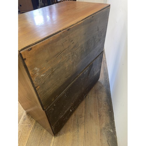 995 - A teak military style chest, having two short and three long drawers, 92 cm wide