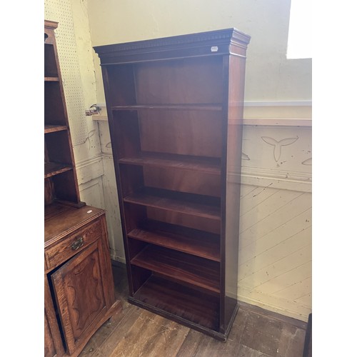 1019 - An oak dresser, 90 cm wide, a mahogany bookcase, a mahogany chair, a corner cabinet, a wine table, a... 