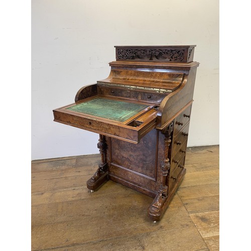 1033 - A 19th century walnut piano Davenport, with a rising superstructure, and hinged top to reveal a fitt... 