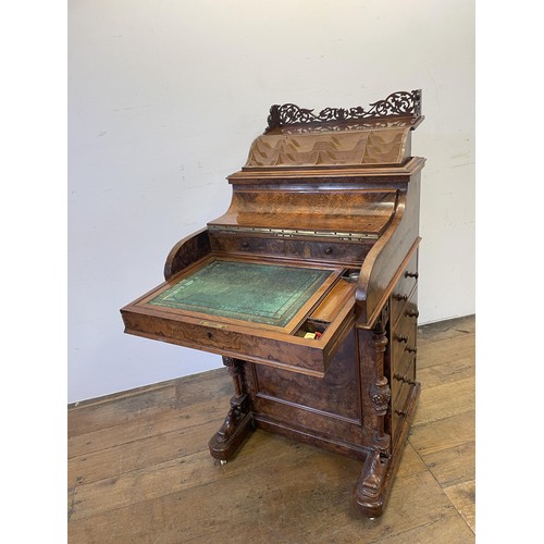 1033 - A 19th century walnut piano Davenport, with a rising superstructure, and hinged top to reveal a fitt... 