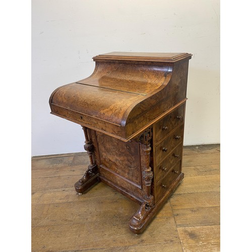 1033 - A 19th century walnut piano Davenport, with a rising superstructure, and hinged top to reveal a fitt... 