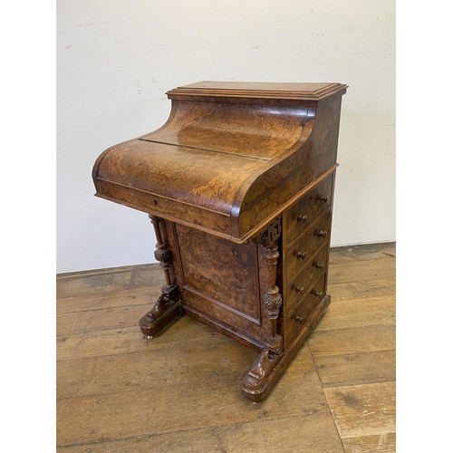 1033 - A 19th century walnut piano Davenport, with a rising superstructure, and hinged top to reveal a fitt... 