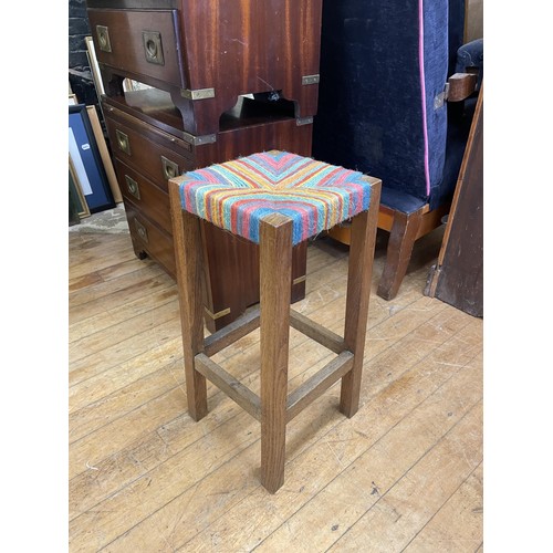 1073 - A pair of military style bedside chests, having a brushing slide and three drawers, a pine cupboard,... 