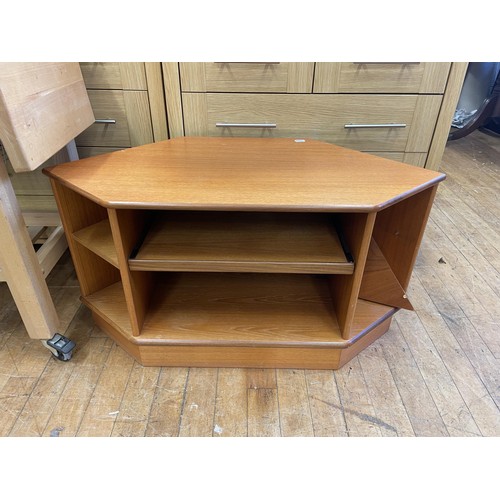 1069 - A yew wood pedestal desk, 114 cm wide, a TV stand, a reclining chair and matching stool, and assorte... 