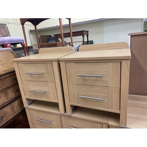 1069 - A yew wood pedestal desk, 114 cm wide, a TV stand, a reclining chair and matching stool, and assorte... 