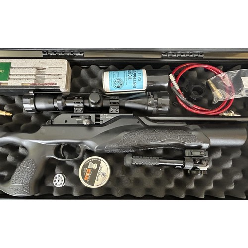 620 - A Carl Walther .22 air rifle, with folding bi-pod, telescopic sight, a gas bottle and other accessor... 