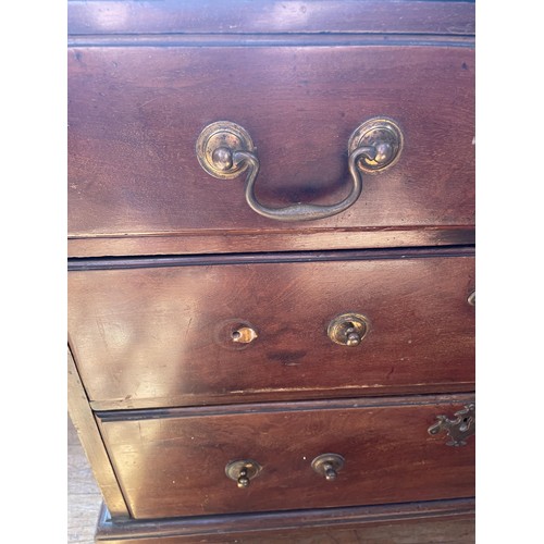 1049 - A 19th century mahogany chest, having a brushing slide above four long graduated drawers, 76 cm wide