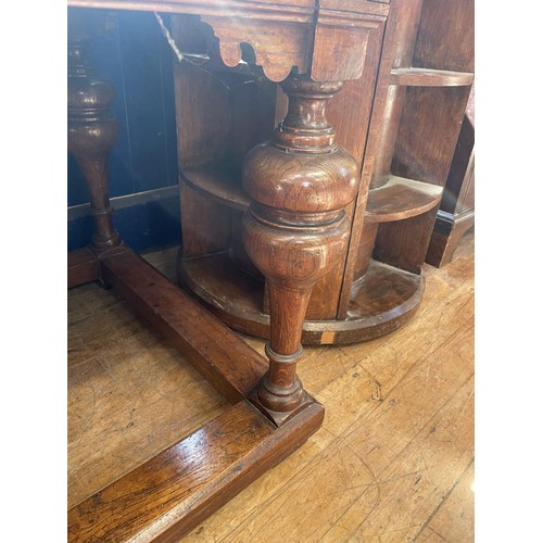 1051 - A 17th century Dutch style oak drawleaf dining table, on bulbous legs united by stretchers, the top ... 