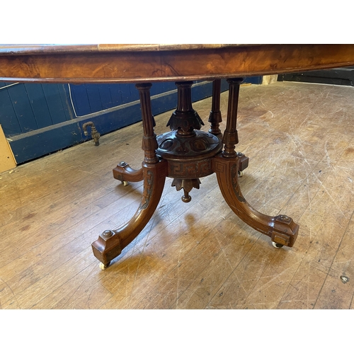 1088 - A Victorian walnut oval table, 125 cm wide, a side table, inset with with an embroidered panel, a co... 