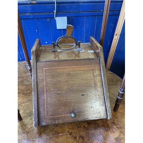 1088 - A Victorian walnut oval table, 125 cm wide, a side table, inset with with an embroidered panel, a co... 