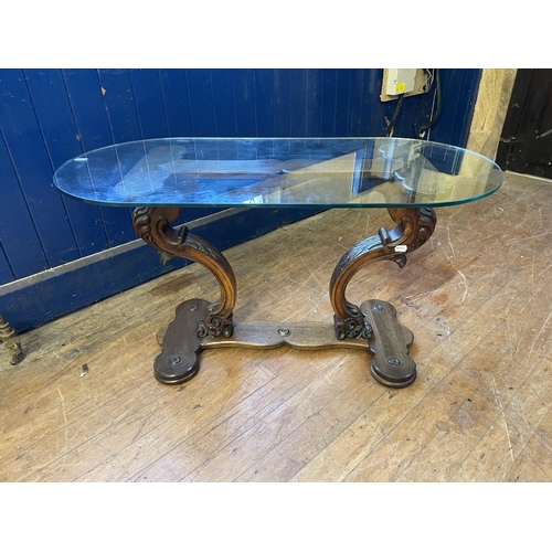 1088 - A Victorian walnut oval table, 125 cm wide, a side table, inset with with an embroidered panel, a co... 