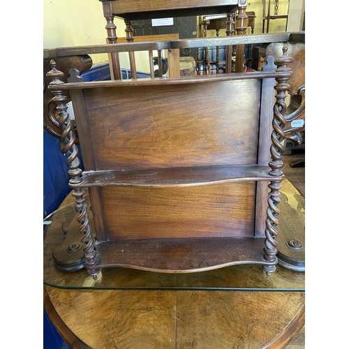 1088 - A Victorian walnut oval table, 125 cm wide, a side table, inset with with an embroidered panel, a co... 