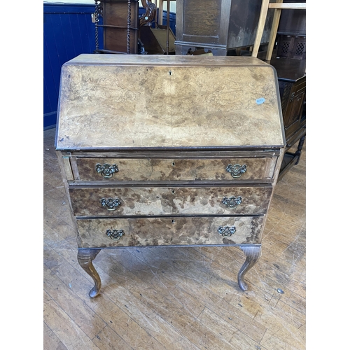 1088 - A Victorian walnut oval table, 125 cm wide, a side table, inset with with an embroidered panel, a co... 