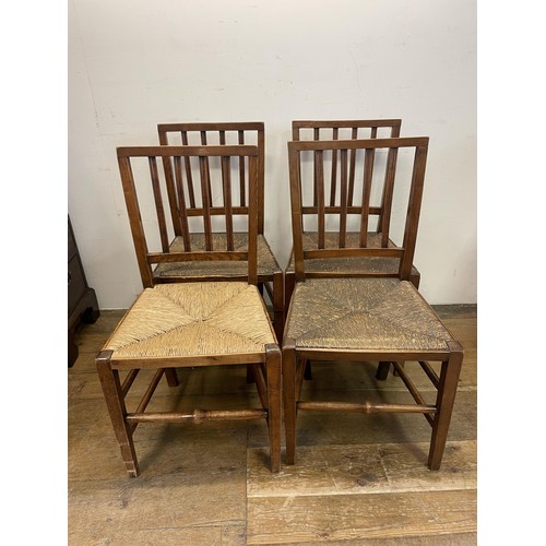 1104 - A set of four rail back dining chairs, with reeded seats (4)