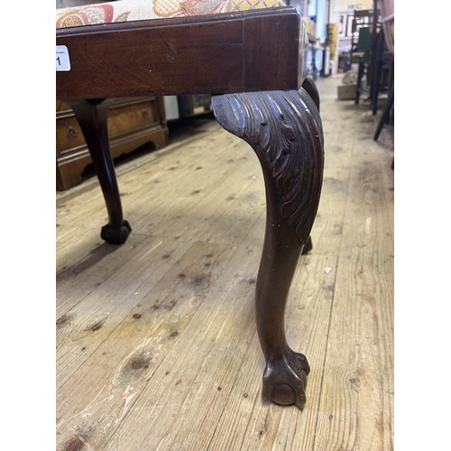 1101 - A mahogany stool, with a drop in seat, on carved cabriole legs to claw and ball feet, 50 cm wide