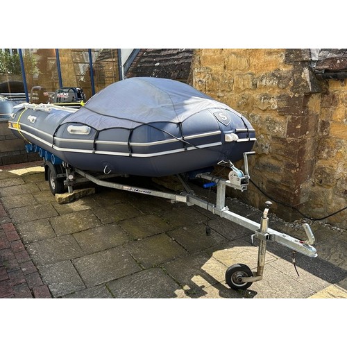 802 - An Excel Vanguard 395 inflatable dinghy, with a Suzuki 20hp Four Stroke lean burn engine, on an Extr... 