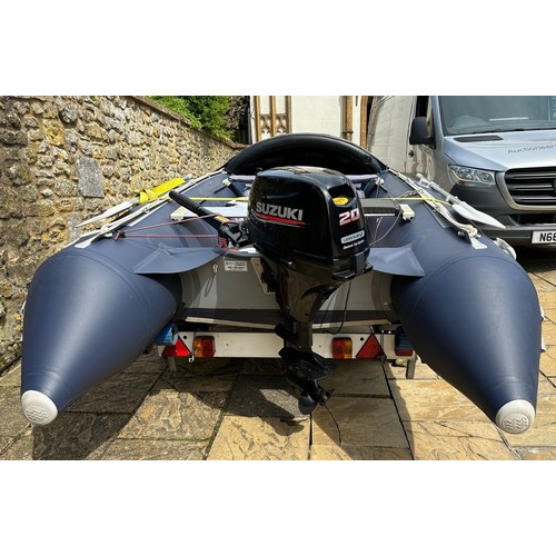 802 - An Excel Vanguard 395 inflatable dinghy, with a Suzuki 20hp Four Stroke lean burn engine, on an Extr... 