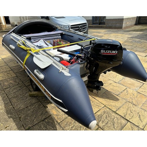 802 - An Excel Vanguard 395 inflatable dinghy, with a Suzuki 20hp Four Stroke lean burn engine, on an Extr... 