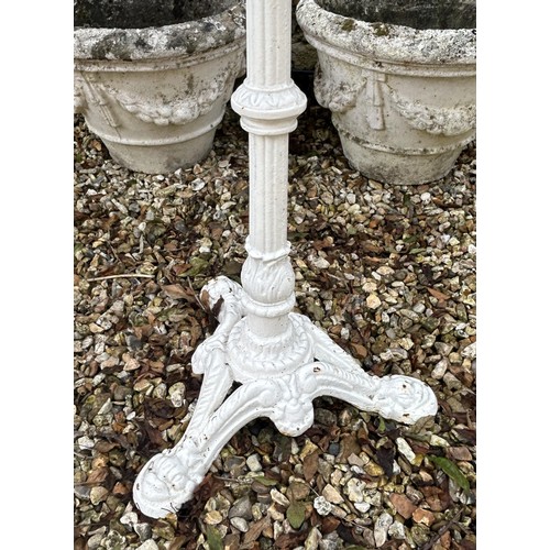 1096 - A painted cast iron table base, with a marble top, 36 cm wide