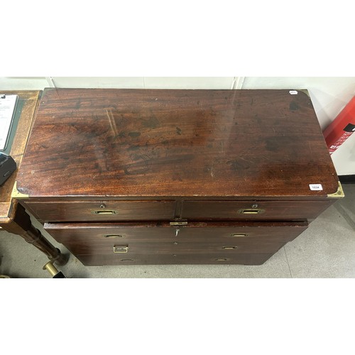 1034 - A mahogany and brass bound military chest, the top having two short and one long drawers, the base w... 