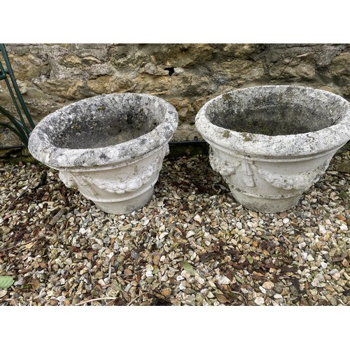 1110 - A pair of composite stone garden planters, 50 cm diameter, and a garden statue (3)