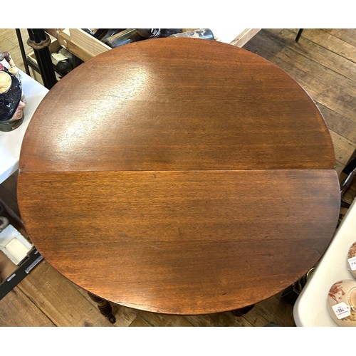 1013 - A mahogany demi-lune tea table, on turned legs, 109 cm wide