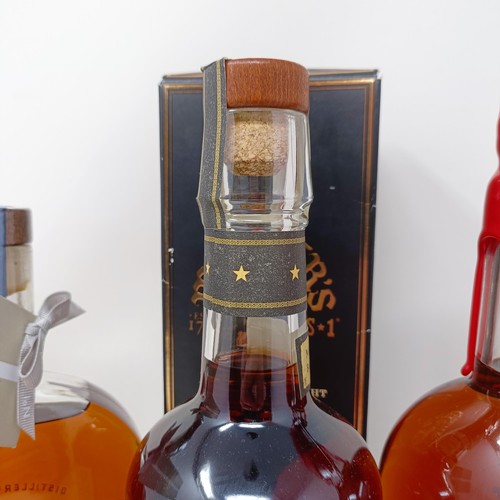 1214 - A bottle of Maker's Mark whisky, a bottle of Woodford Reserve whiskey, and another bottle of whisky,... 