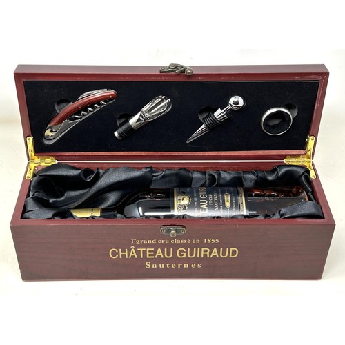 1329 - A bottle of Chateau Guiraud Premier Cru Sauternes, 1998, in a presentation box with wine accessories