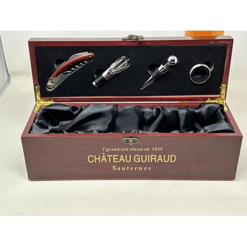 1329 - A bottle of Chateau Guiraud Premier Cru Sauternes, 1998, in a presentation box with wine accessories