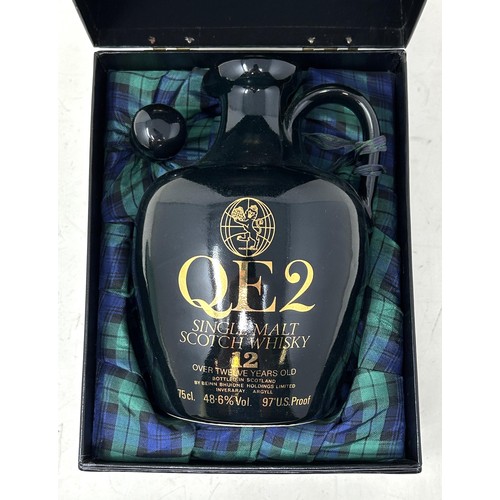 1332 - A commemorative whisky jug, Cunard QE2, containing 12 year old Scotch whisky, in a presentation box