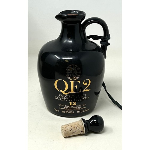 1332 - A commemorative whisky jug, Cunard QE2, containing 12 year old Scotch whisky, in a presentation box