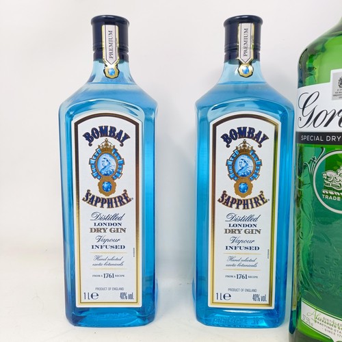 1268 - Three litre bottles of Bombay Sapphire, and a litre bottle of Gordon's gin (4)