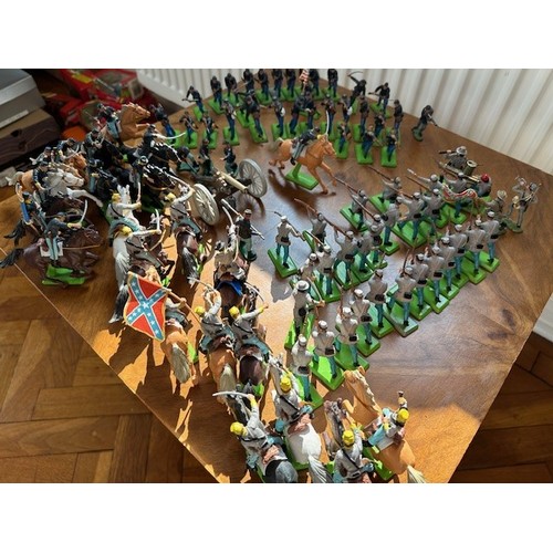 325 - A collection of Britains plastic cowboys, Indians, medieval, other figures and accessories