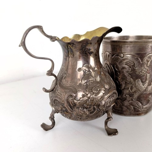 1062 - A 19th century silver cream jug and a Russian silver beaker, with assay master mark for Anatoly Apol... 