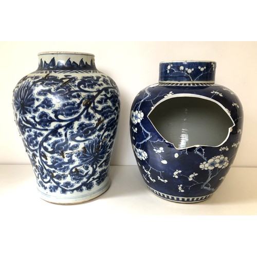 1066 - A Chinese blue and white vase, decorated flowers, 36 cm high, and a Chinese blue and white ginger ja... 