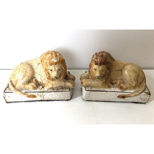 1074 - A pair of pottery lions, on plinth bases, 14 cm wide (2)Provenance: On instructions of the Executors... 