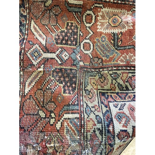 1126 - A Persian red ground carpet, 400 x 222 cmProvenance: On instructions of the Executors - From the est... 