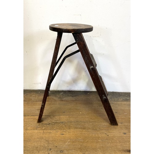 1100 - A folding stool/steps, 60 cm high, and a Continental painted side table, 54 cm wide (2)Provenance: O... 