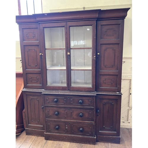 1103 - An unusual 19th century dresser, painted to simulate oak, the top with two glazed doors flanked by t... 