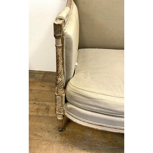 1121 - A George III style painted settee, with a padded back, arms and seat, on tapering reeded legs, 183 c... 