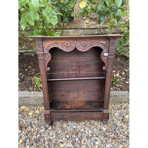 1134 - A painted bookcase, 148 cm wide, and a carved walnut bookcase, 62 cm wide  (2)Provenance: On in... 