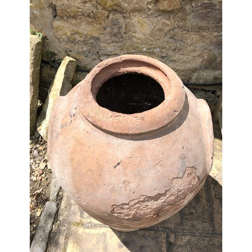 1135 - A terracotta planter, weathered and cracked, 87 cm high, stamped GCProvenance: On instructions of th... 