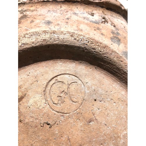 1135 - A terracotta planter, weathered and cracked, 87 cm high, stamped GCProvenance: On instructions of th... 